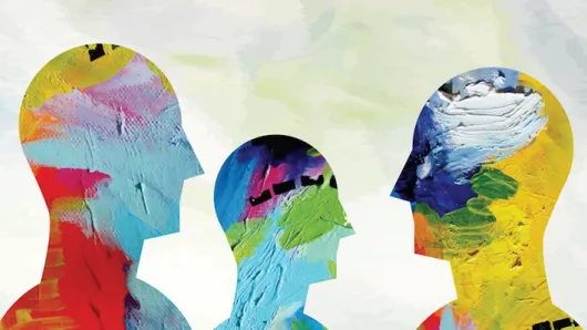 Silhouette of people covered in paint. 