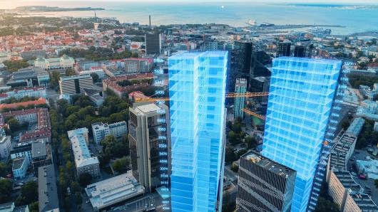 a beautiful city with two digital skyscrapers in the foreground