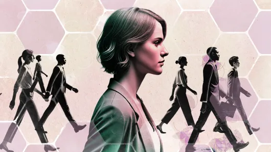 Woman walking with other people walking in the background