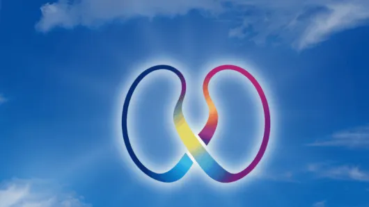 Rainbow ribbons shaped as kidneys with a blue sky behind them.