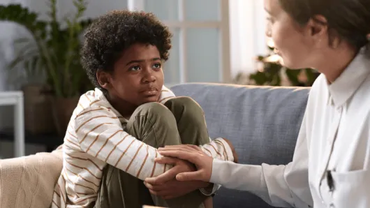 A child speaking to a practitioner.