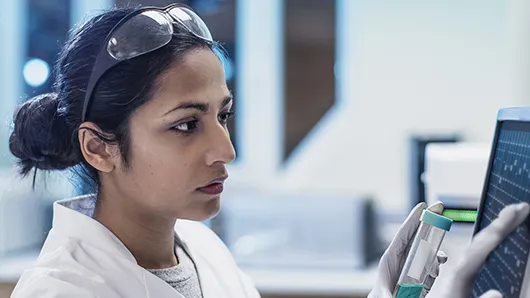 Women at computer assessing research