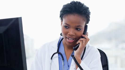 Medical professional answering phone.