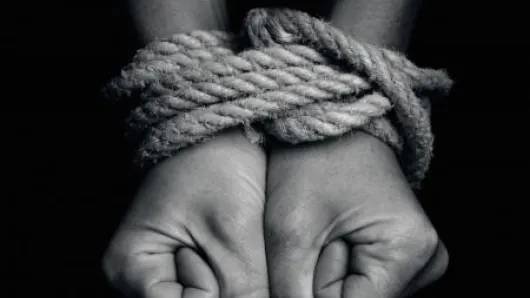 Hands tied with rope