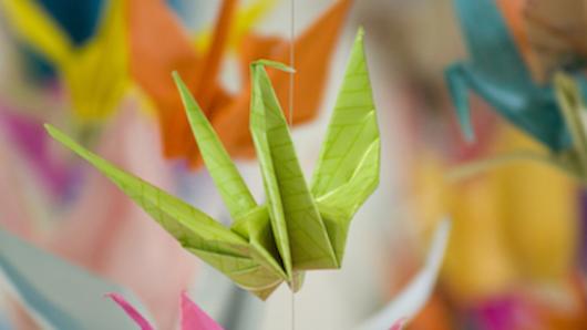 Green origami swan