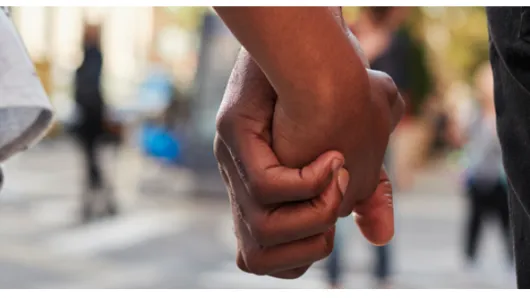 couple holding hands.