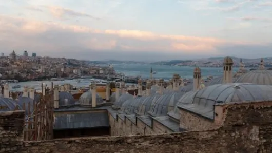 Building rooftops overlooking a body of water