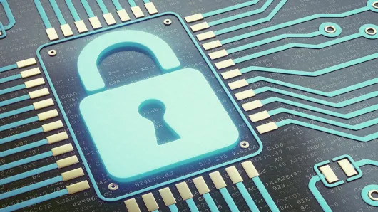 Padlock on a computer chip.