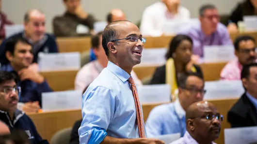 Professor Guhan Subramanian teaching in a classroom of diverse executives