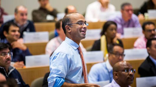 Professor Guhan Subramanian teaching in a classroom of diverse executives