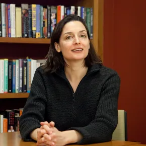 portrait of Hannah Riley Bowles in front of a bookshelf