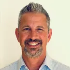a white man with a goatee and greying hair