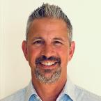 a white man with a goatee and greying hair