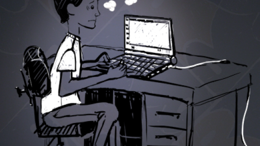 Young man sitting at desk with computer and a thought bubble saying, 